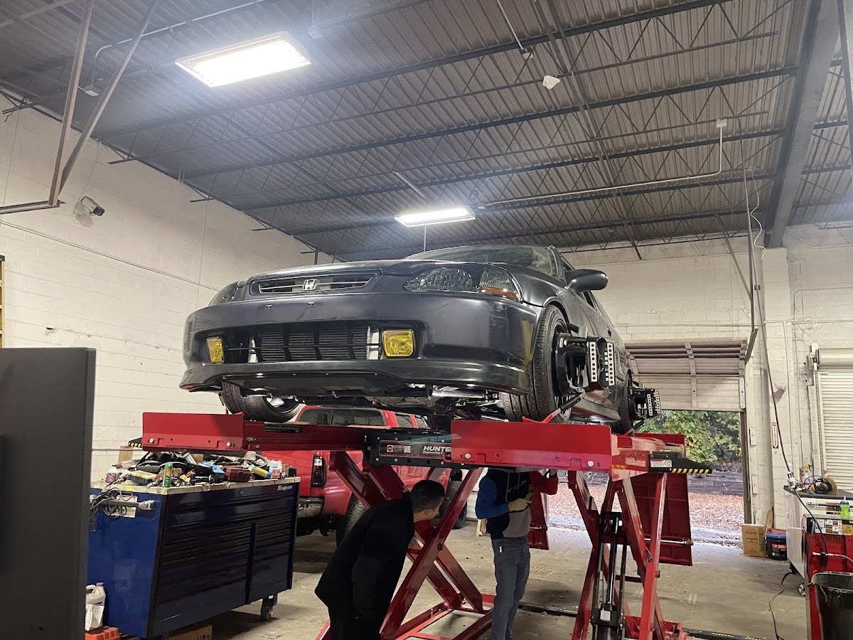 A Honda Civic up on the lift in the Avondale Independent service bay